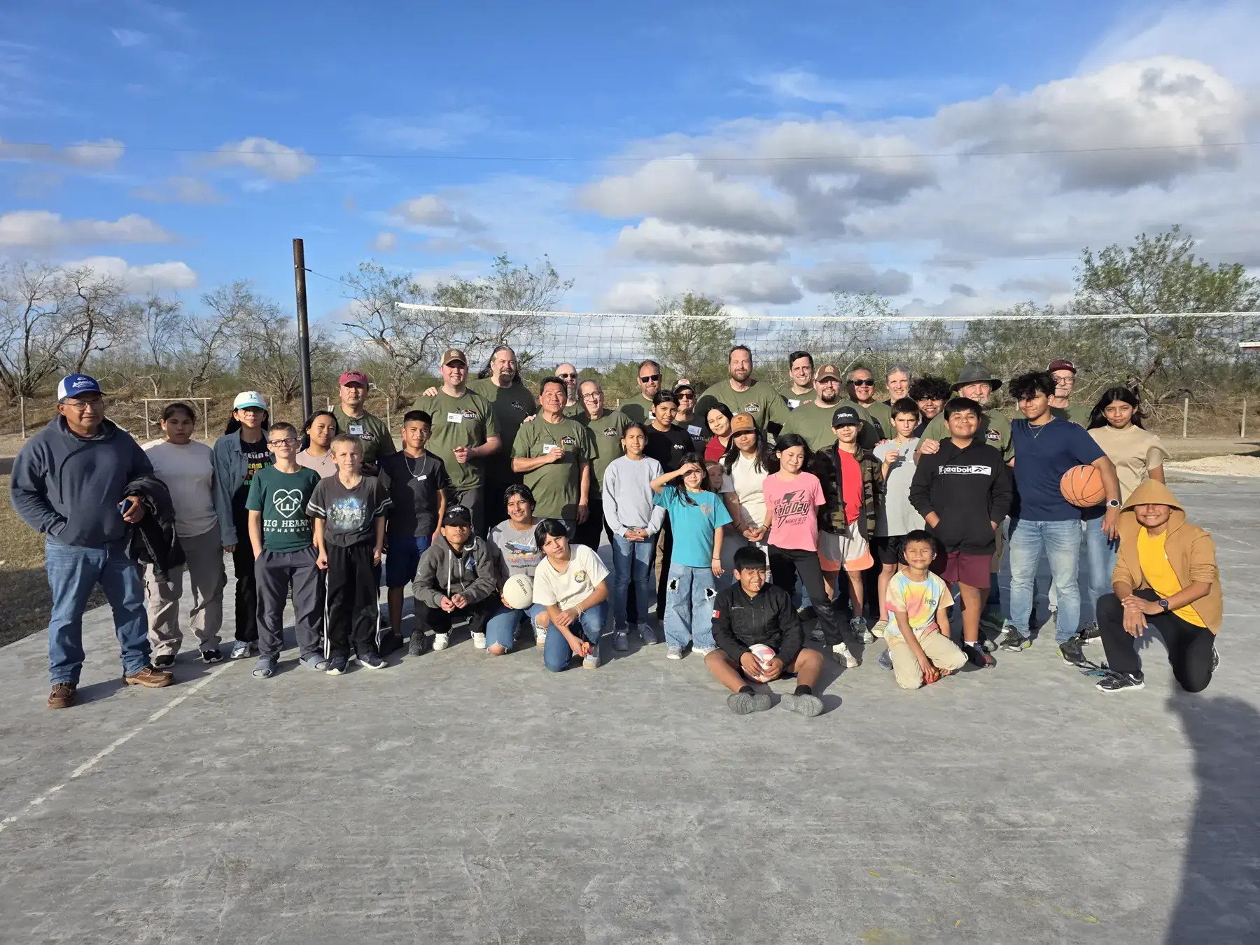 FUERTE team members and children gathering outdoors in Matamoros.
